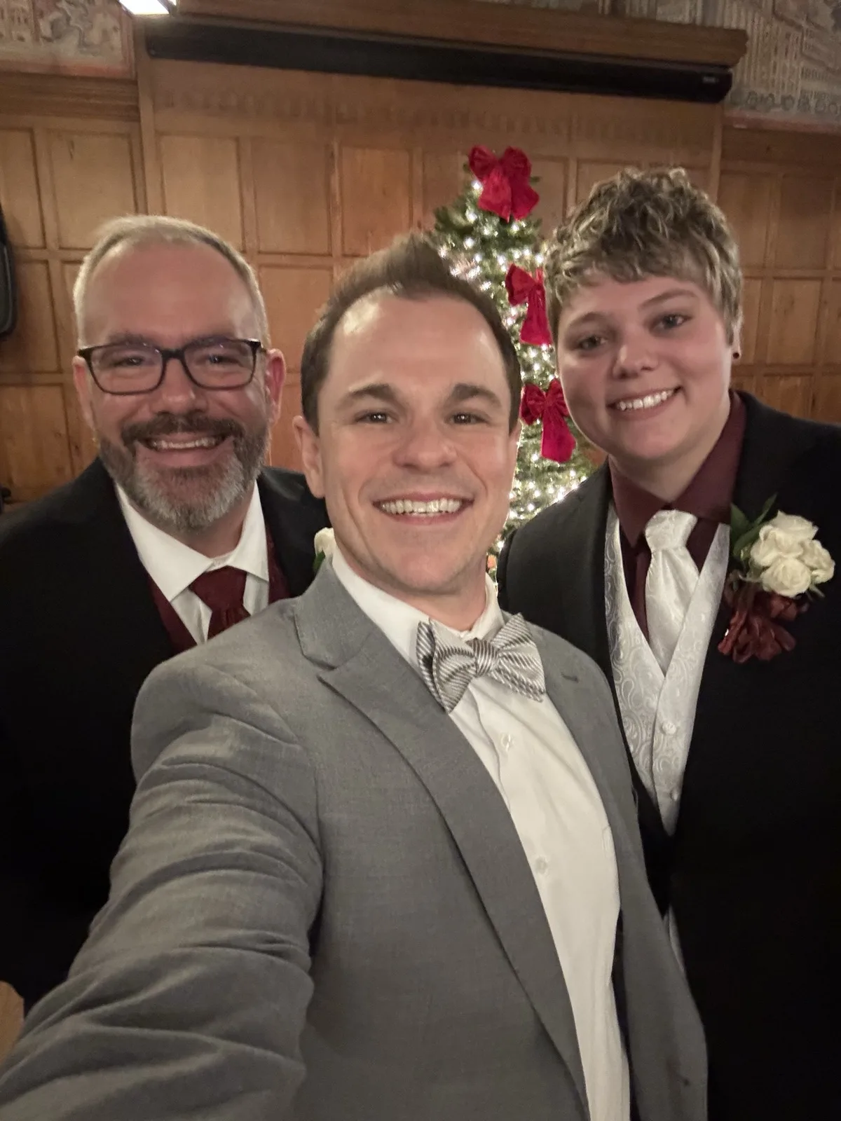 Schwa Potter with LGBTQ couple at holiday wedding ceremony