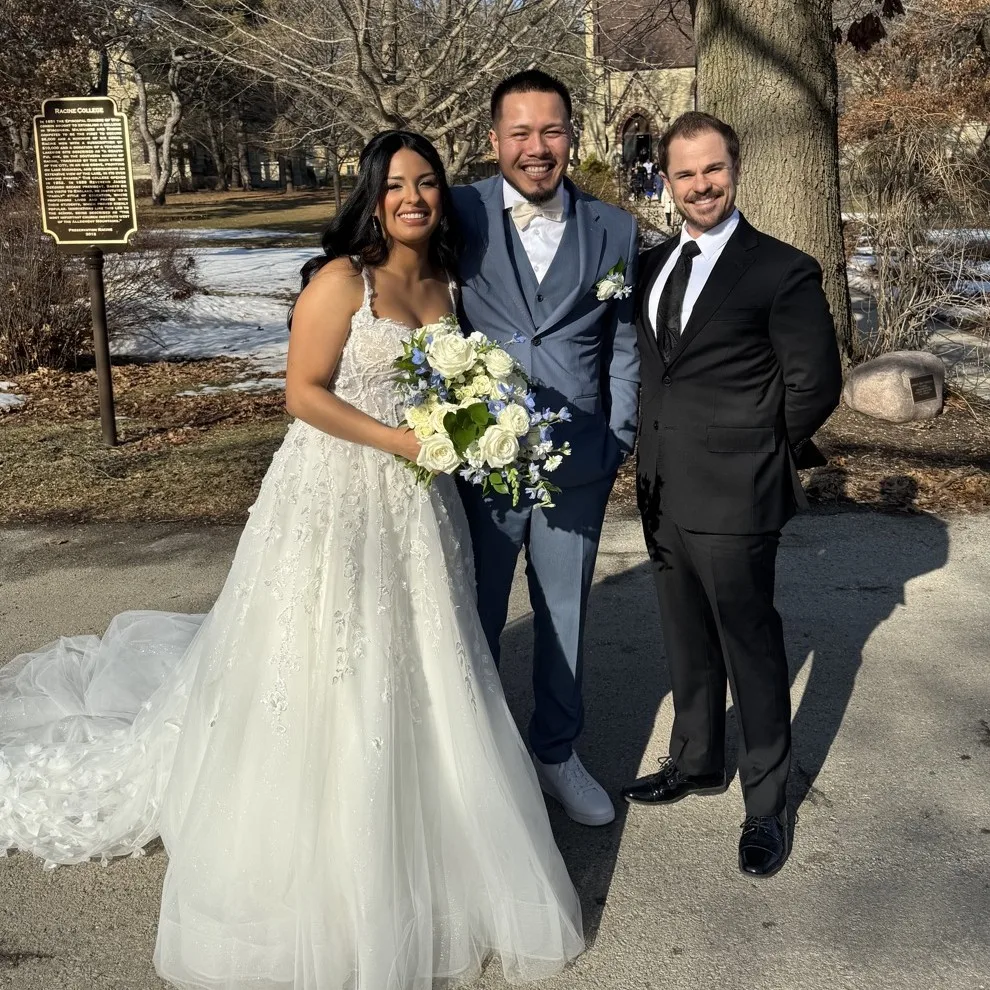 Wedding officiant Schwa Potter with couple outdoors at winter ceremony in Wisconsin